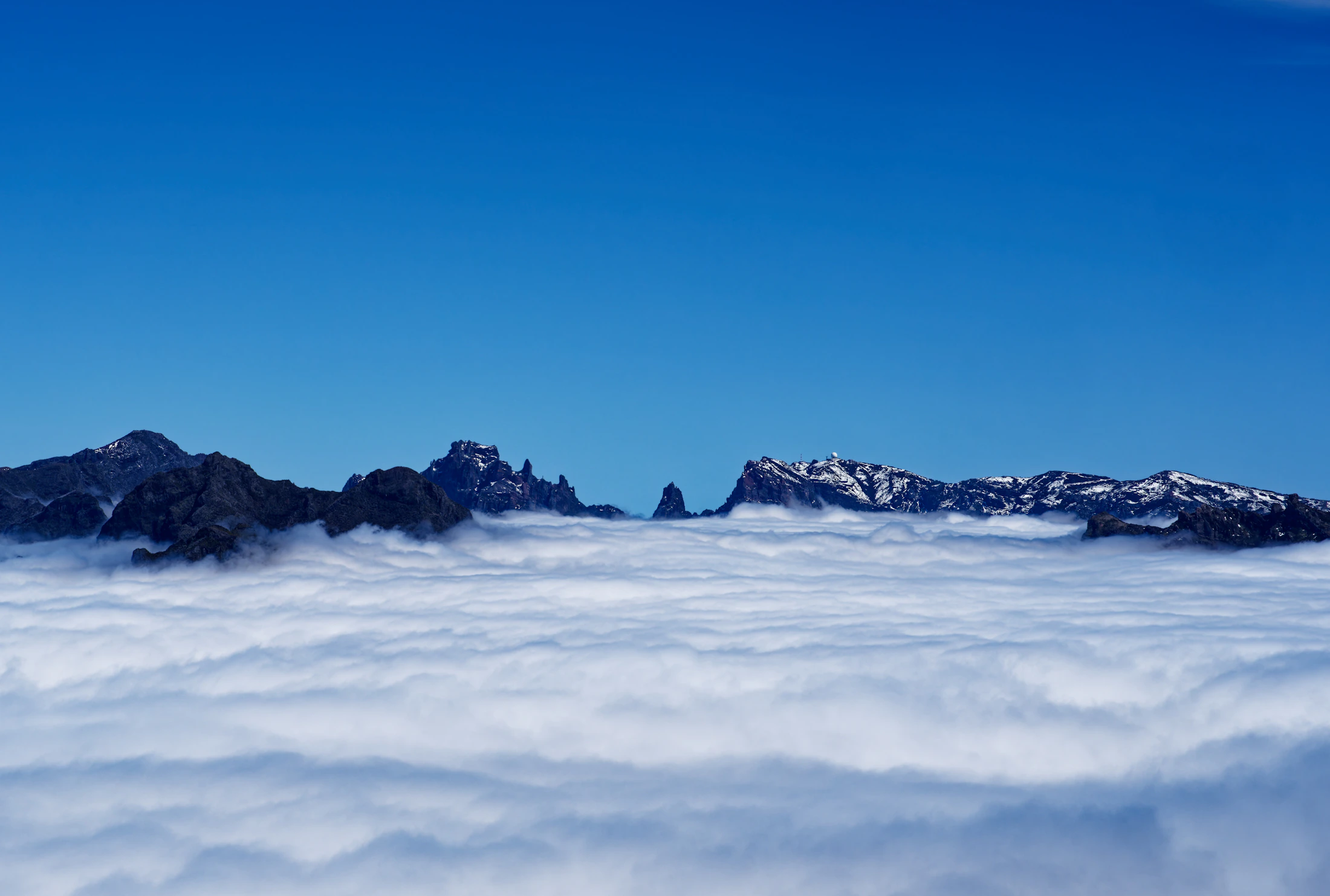 Madeira's mountain peaks above the clouds at Pico do Arieiro