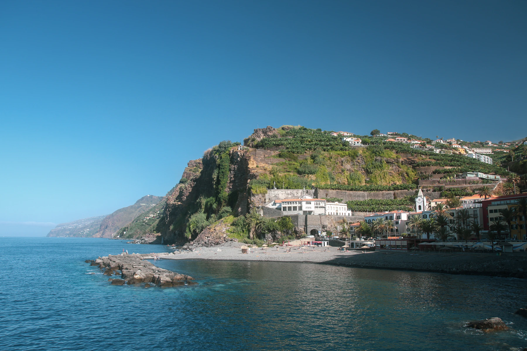 Seafront village and hillside homes in Ponta do Sol, Madeira